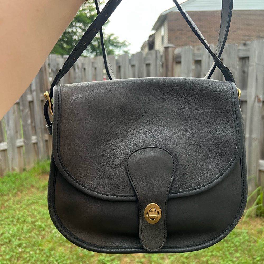 Faded navy vintage coach saddlery bag